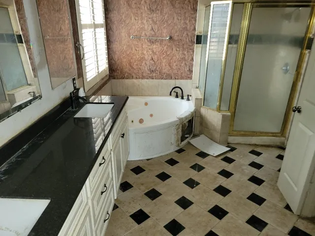 a bathroom with a bathtub and a sink