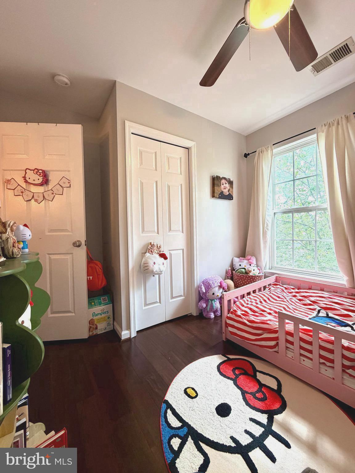 7108 Wheeling Way Gainesville, VA 20155 - Photo 33 of 45 a bedroom with a bed and wooden floor