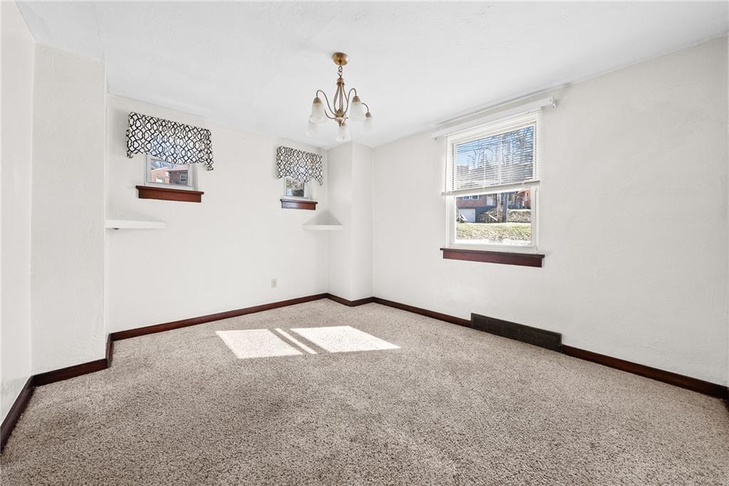 105 Kaplan Avenue Pittsburgh, PA 15227 - Photo 11 of 37 an empty room with windows and closet