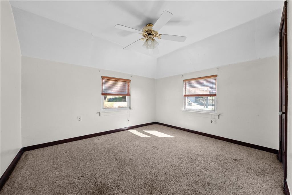 105 Kaplan Avenue Pittsburgh, PA 15227 - Photo 23 of 37 an empty room with a window and a ceiling fan