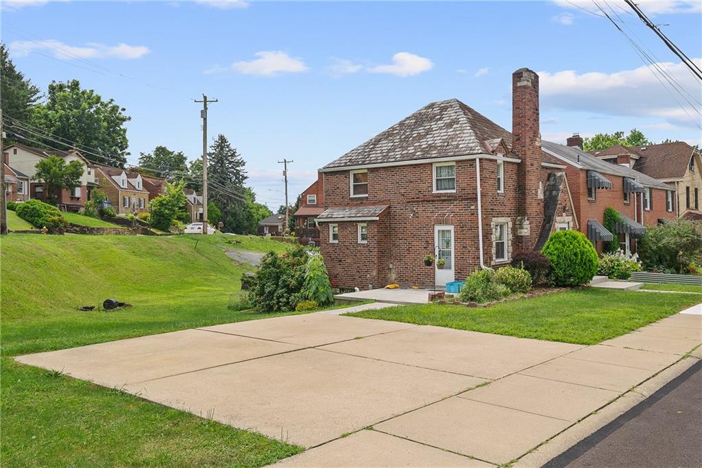 105 Kaplan Avenue Pittsburgh, PA 15227 - Photo 3 of 37 a front view of a house with garden
