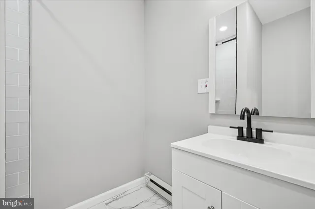 a bathroom with a sink and a mirror