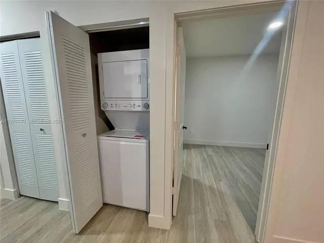 a view of hallway with washer and dryer