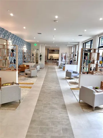 a room with pool table and window