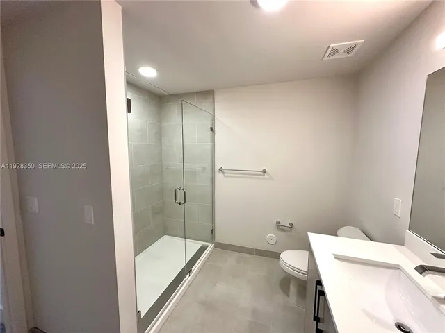 a bathroom with a tub and a toilet