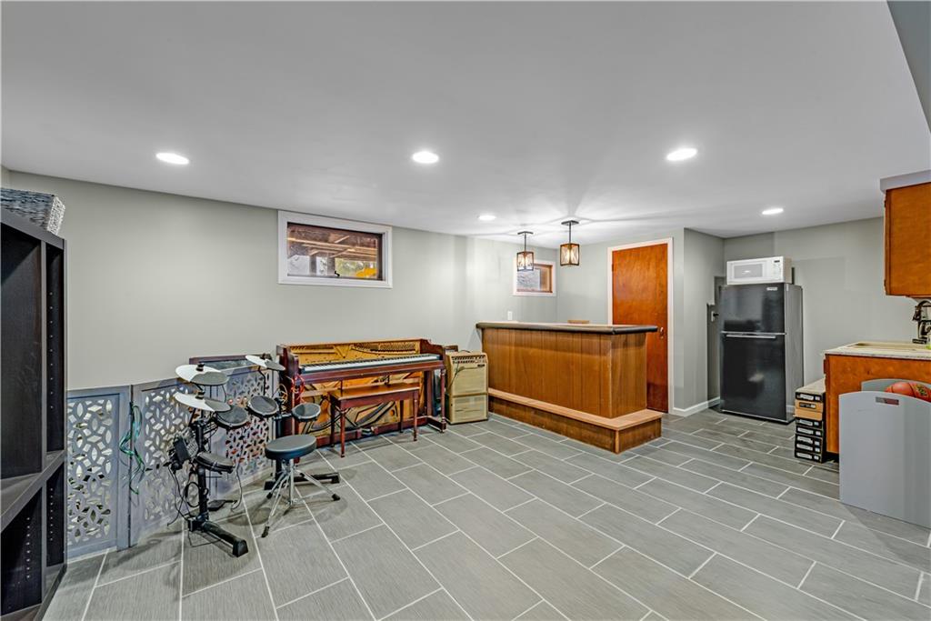 224 Kaufman Church Road Davidsville, PA 15928 - Photo 15 of 25 a room with gym equipment and stainless steel appliances