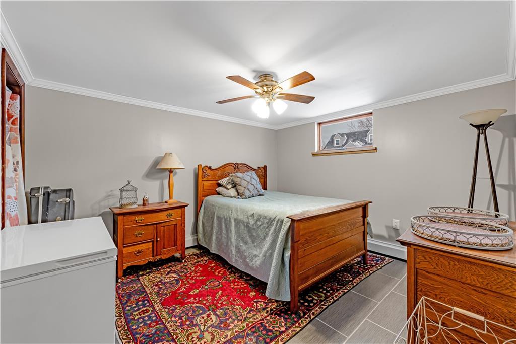 224 Kaufman Church Road Davidsville, PA 15928 - Photo 18 of 25 a bedroom with a bed and a chandelier