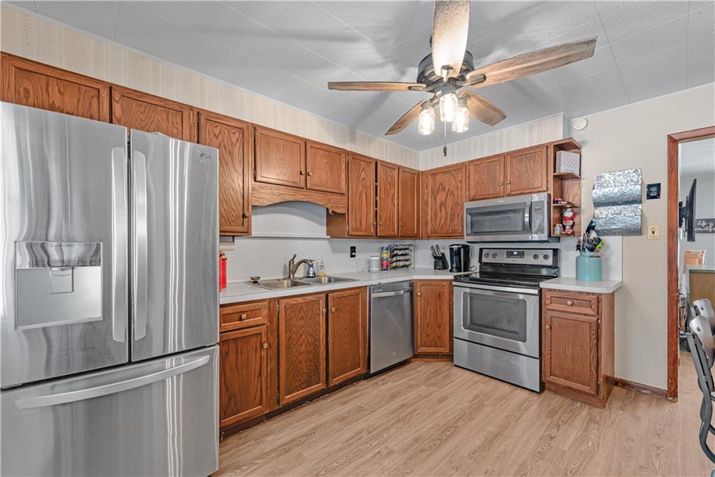 224 Kaufman Church Road Davidsville, PA 15928 - Photo 6 of 25 a kitchen with stainless steel appliances a refrigerator sink and stove