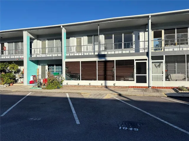 a front view of a building with a street