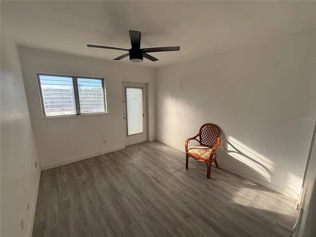 a room with a chair and a window