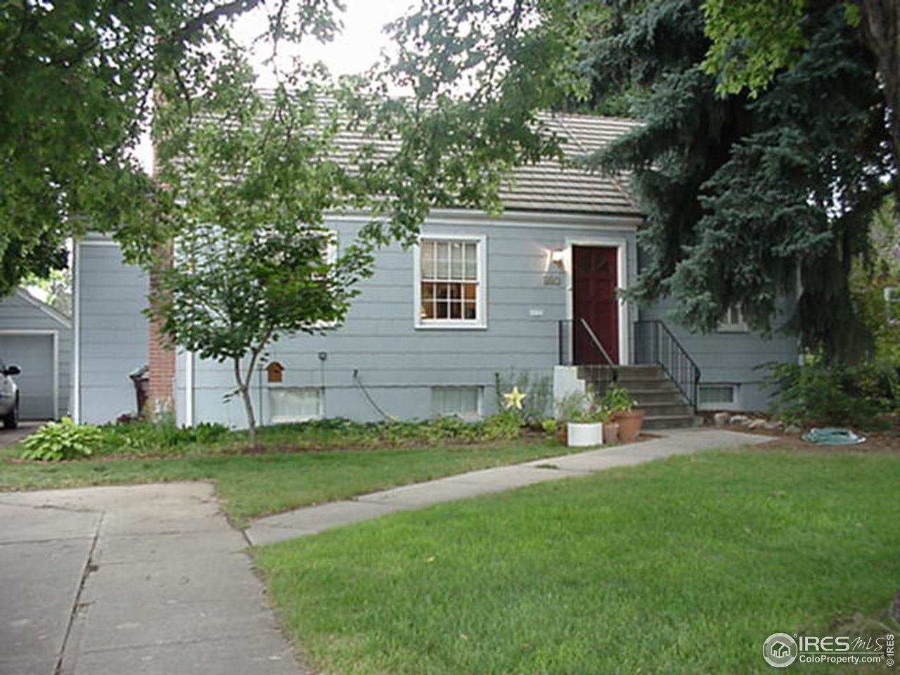 409 East Prospect Road Fort Collins, CO 80525 - Photo 1 of 10 a front view of a house with a yard