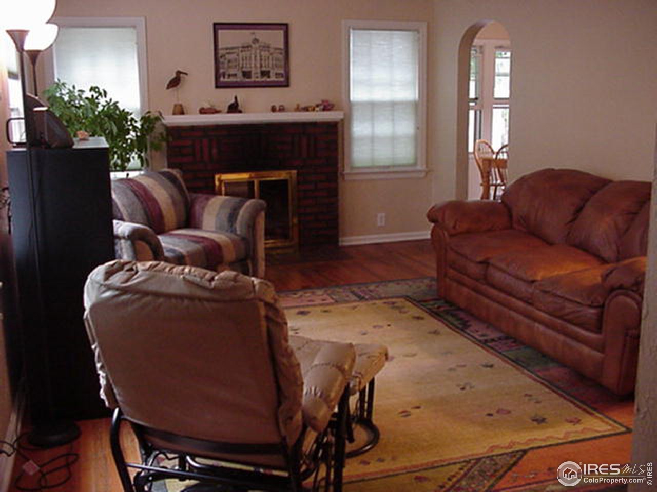 409 East Prospect Road Fort Collins, CO 80525 - Photo 2 of 10 a living room with furniture and a fireplace