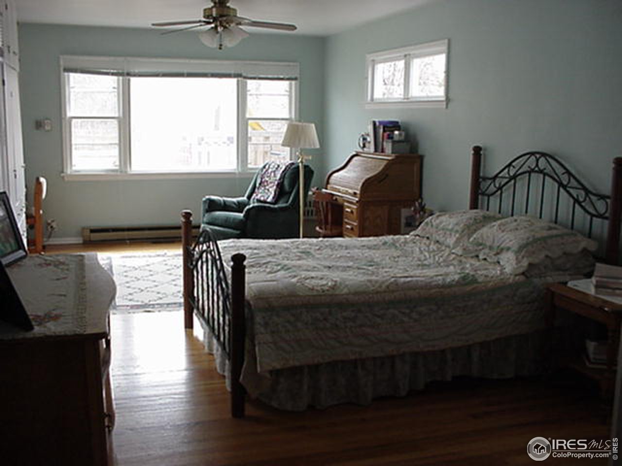 409 East Prospect Road Fort Collins, CO 80525 - Photo 5 of 10 a bedroom with a bed and wooden floor