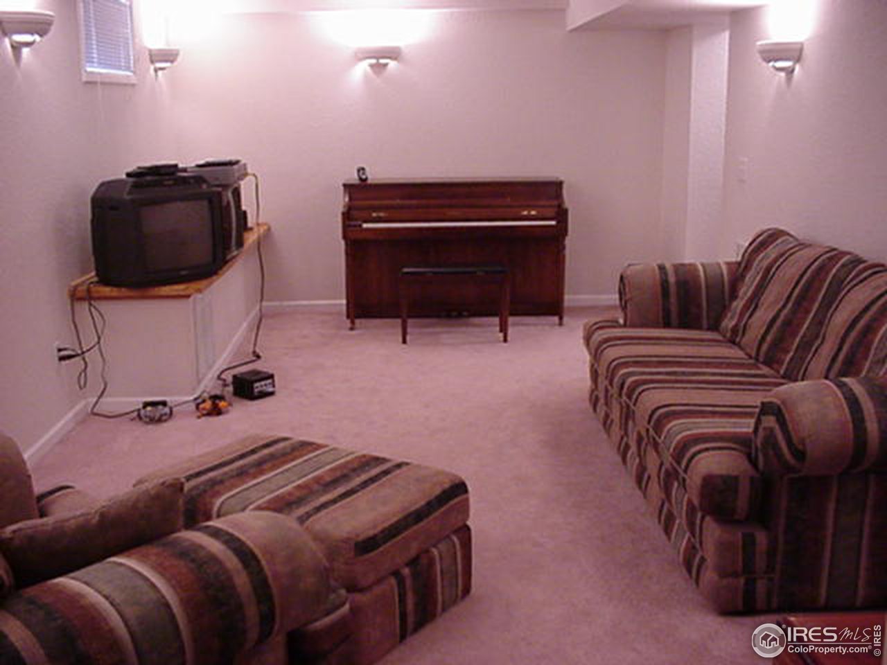 409 East Prospect Road Fort Collins, CO 80525 - Photo 7 of 10 a bedroom with a bed and a television