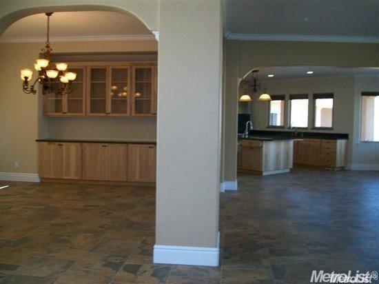 20552 Buchanan Hollow Road, Unit 1 Le Grand, CA 95333 - Photo 15 of 26 a view of kitchen and dining room with chandelier