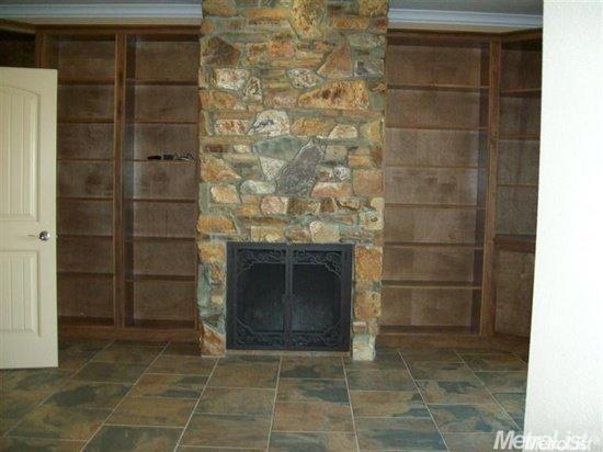 20552 Buchanan Hollow Road, Unit 1 Le Grand, CA 95333 - Photo 16 of 26 a living room with a fireplace