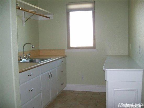 20552 Buchanan Hollow Road, Unit 1 Le Grand, CA 95333 - Photo 21 of 26 a bathroom with a sink and a mirror