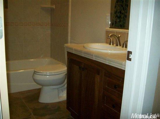 20552 Buchanan Hollow Road, Unit 1 Le Grand, CA 95333 - Photo 23 of 26 a bathroom with a sink and a toilet