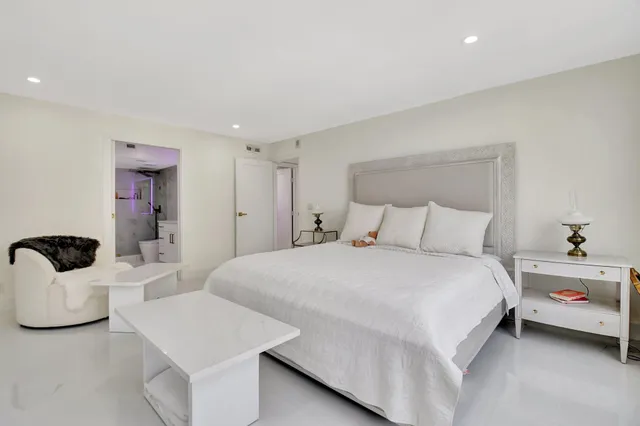 a view of swimming pool with outdoor seating and lake view