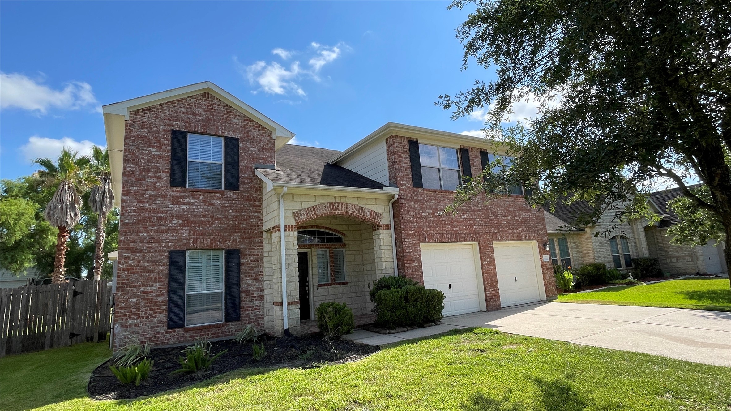 3518 Ewing Drive Manvel, TX 77578 - Photo 1 of 50 a front view of a house with garden
