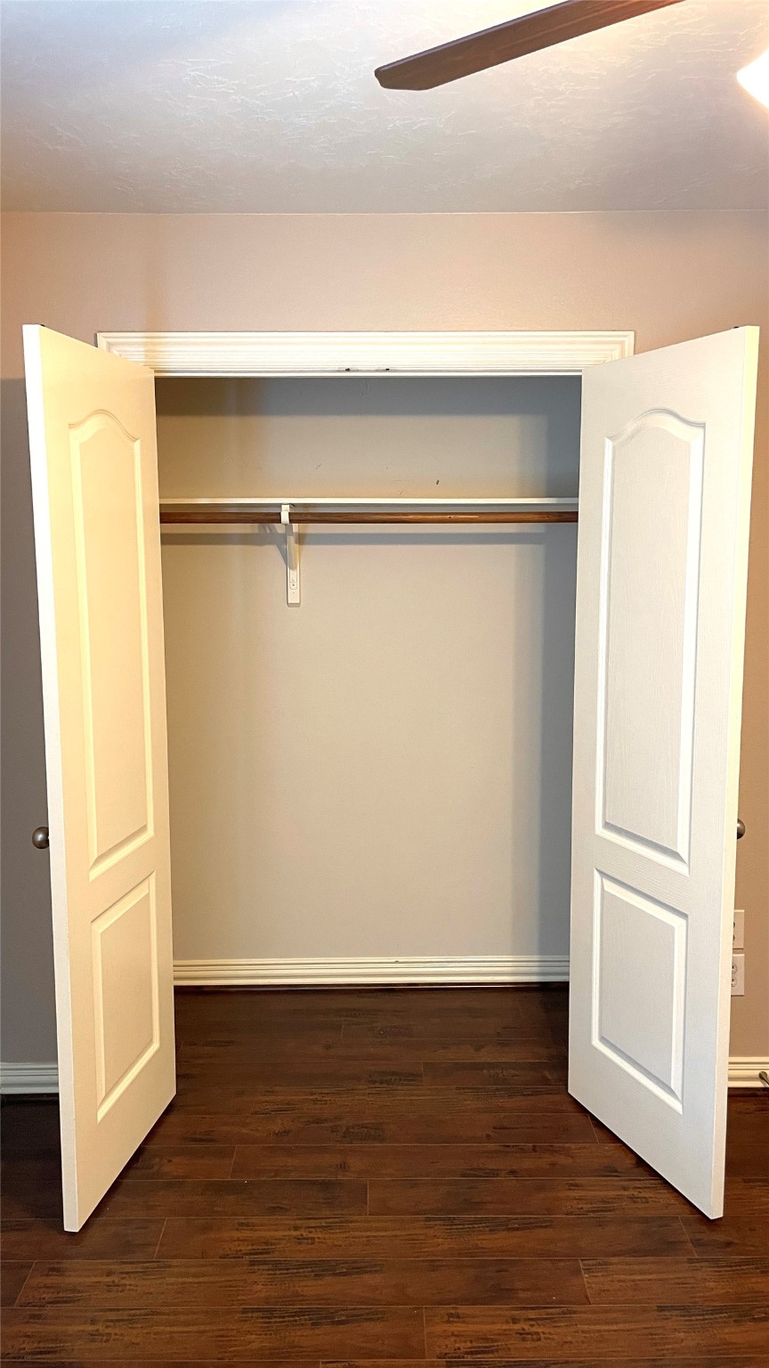 3518 Ewing Drive Manvel, TX 77578 - Photo 34 of 50 a view of an empty room with wooden floor and a refrigerator