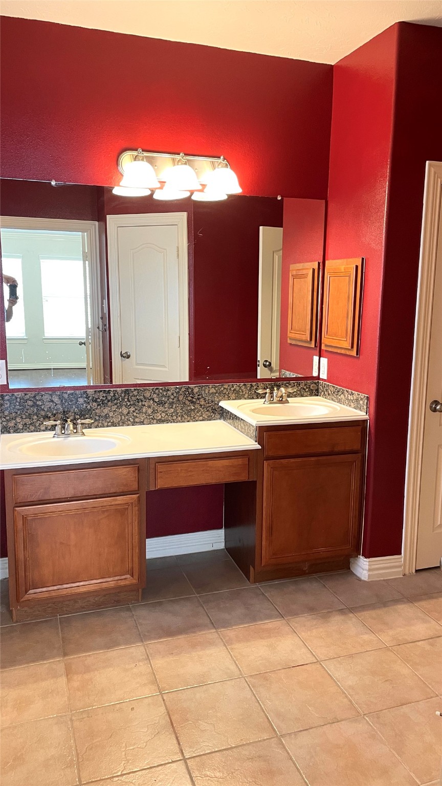 3518 Ewing Drive Manvel, TX 77578 - Photo 40 of 50 a bathroom with a sink and a mirror