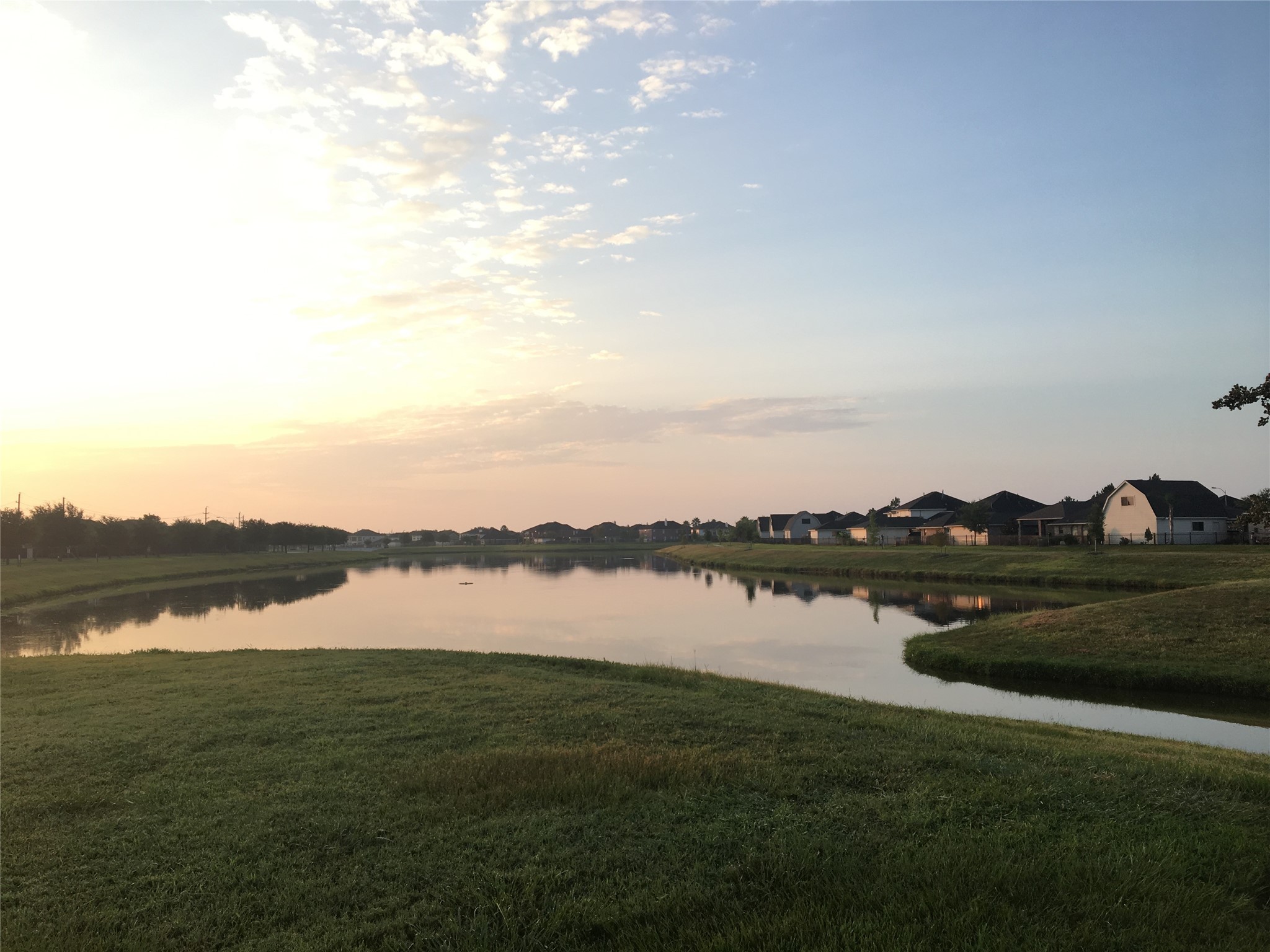 3518 Ewing Drive Manvel, TX 77578 - Photo 48 of 50 a view of a lake with houses in the background