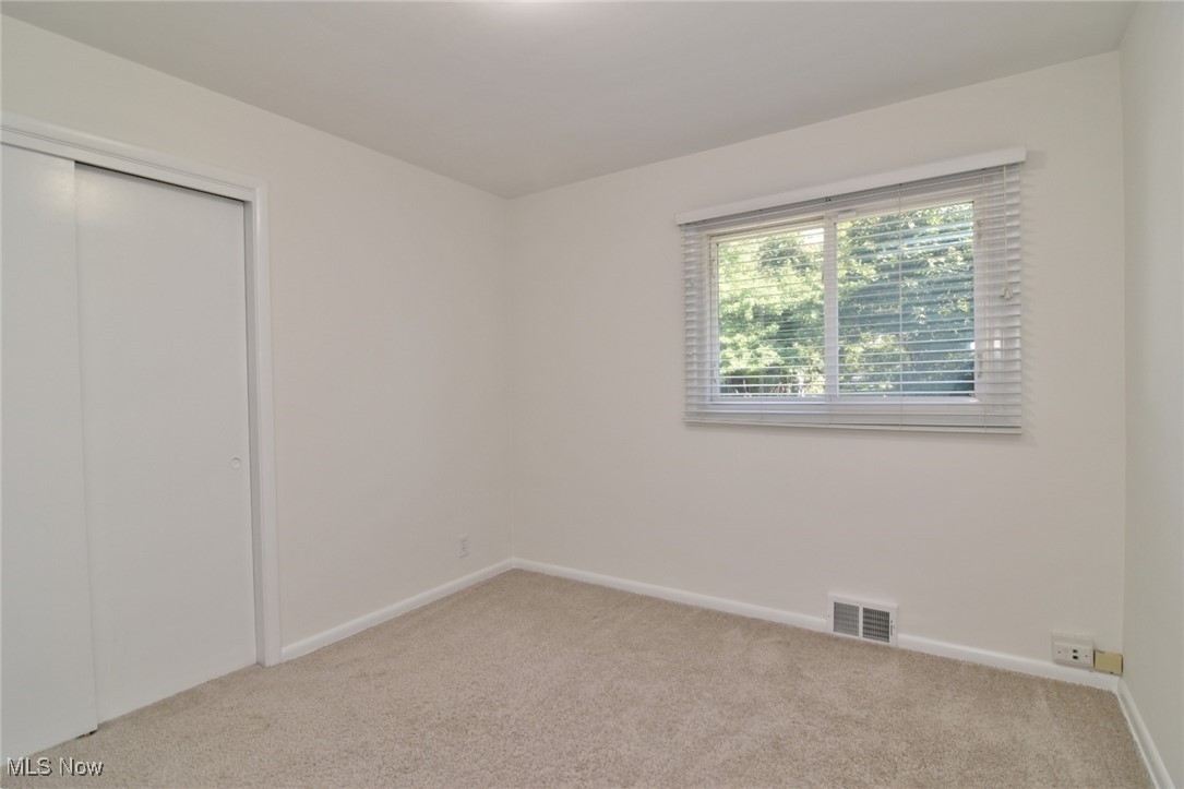 981 Hanley Road Cleveland, OH 44124 - Photo 25 of 42 Unfurnished bedroom with light carpet and a closet