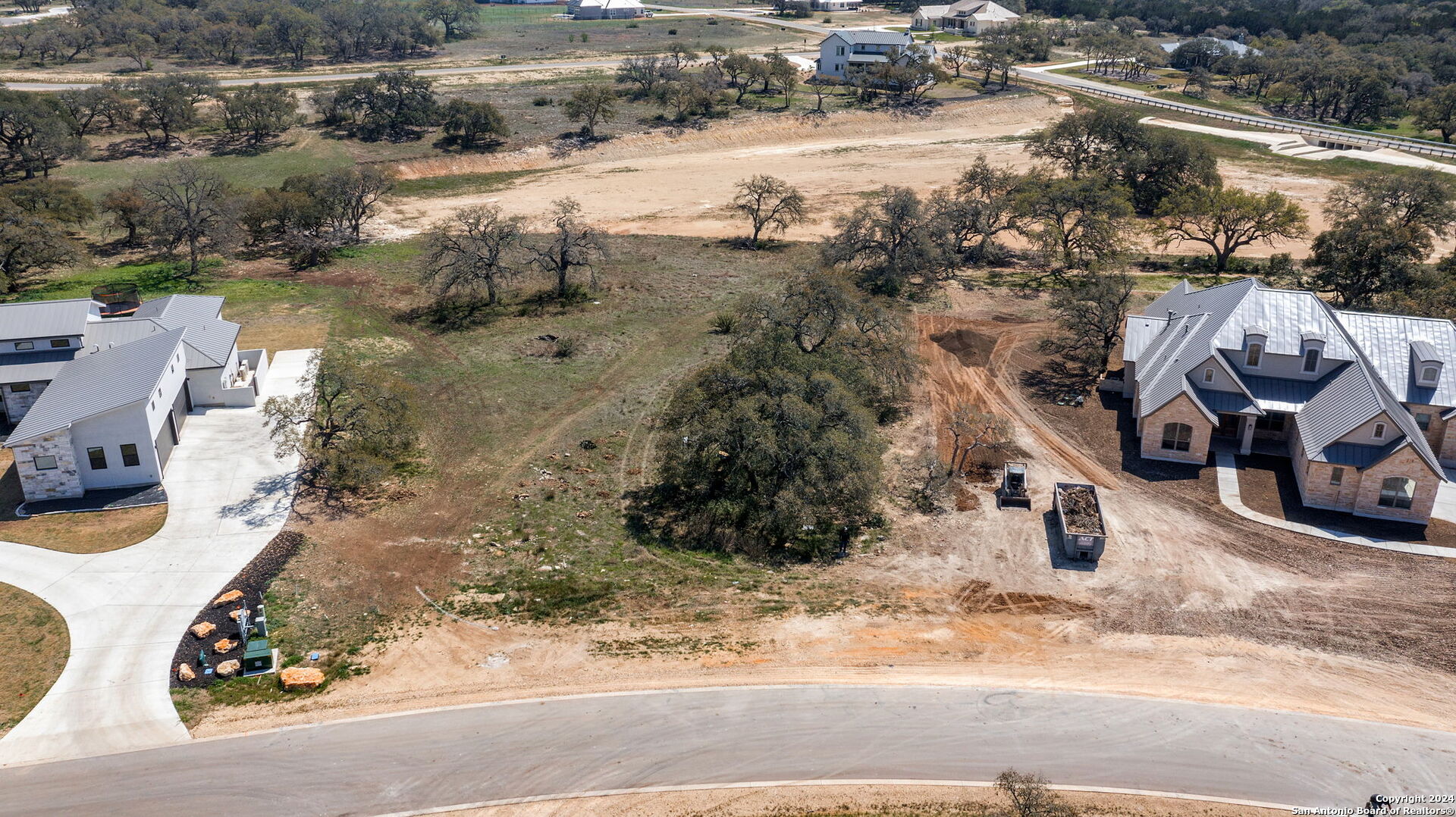 979 Maximino Rdg Road Bulverde, TX 78163 - Photo 2 of 14 a view of a lake with houses