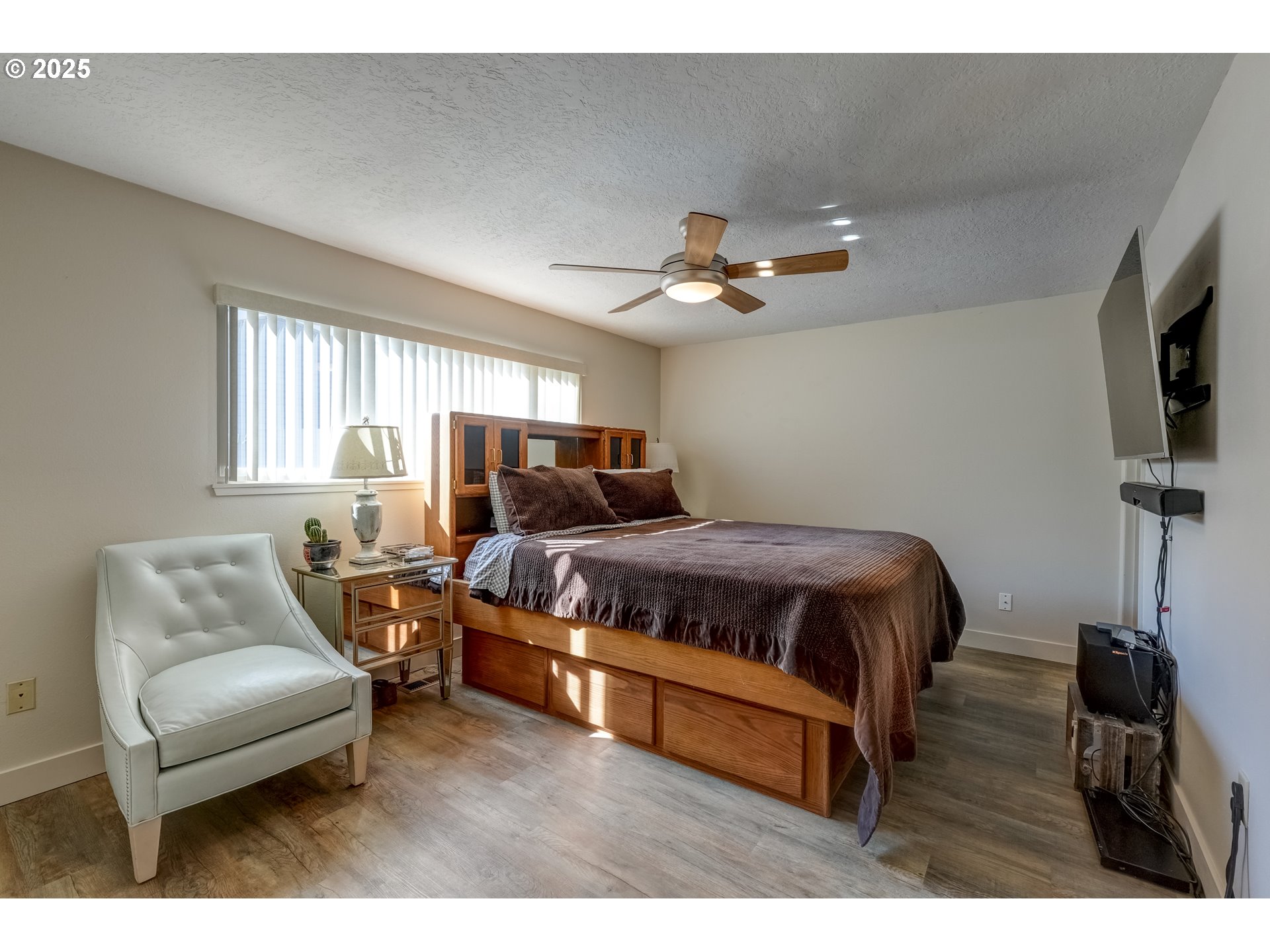 1421 Southwest 6th Place Gresham, OR 97080 - Photo 15 of 27 a bedroom with a bed a window and a flat screen television