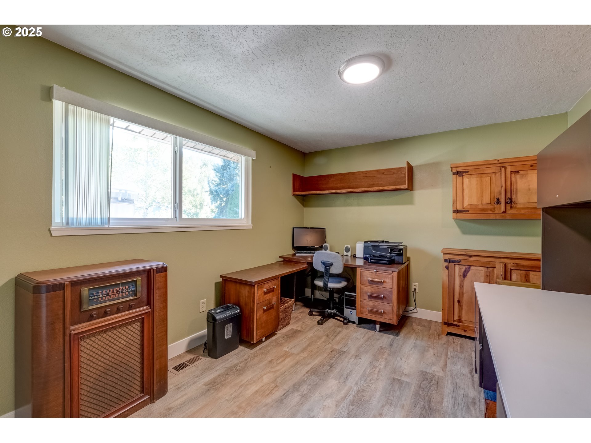 1421 Southwest 6th Place Gresham, OR 97080 - Photo 18 of 27 a living room with furniture and a wooden floor