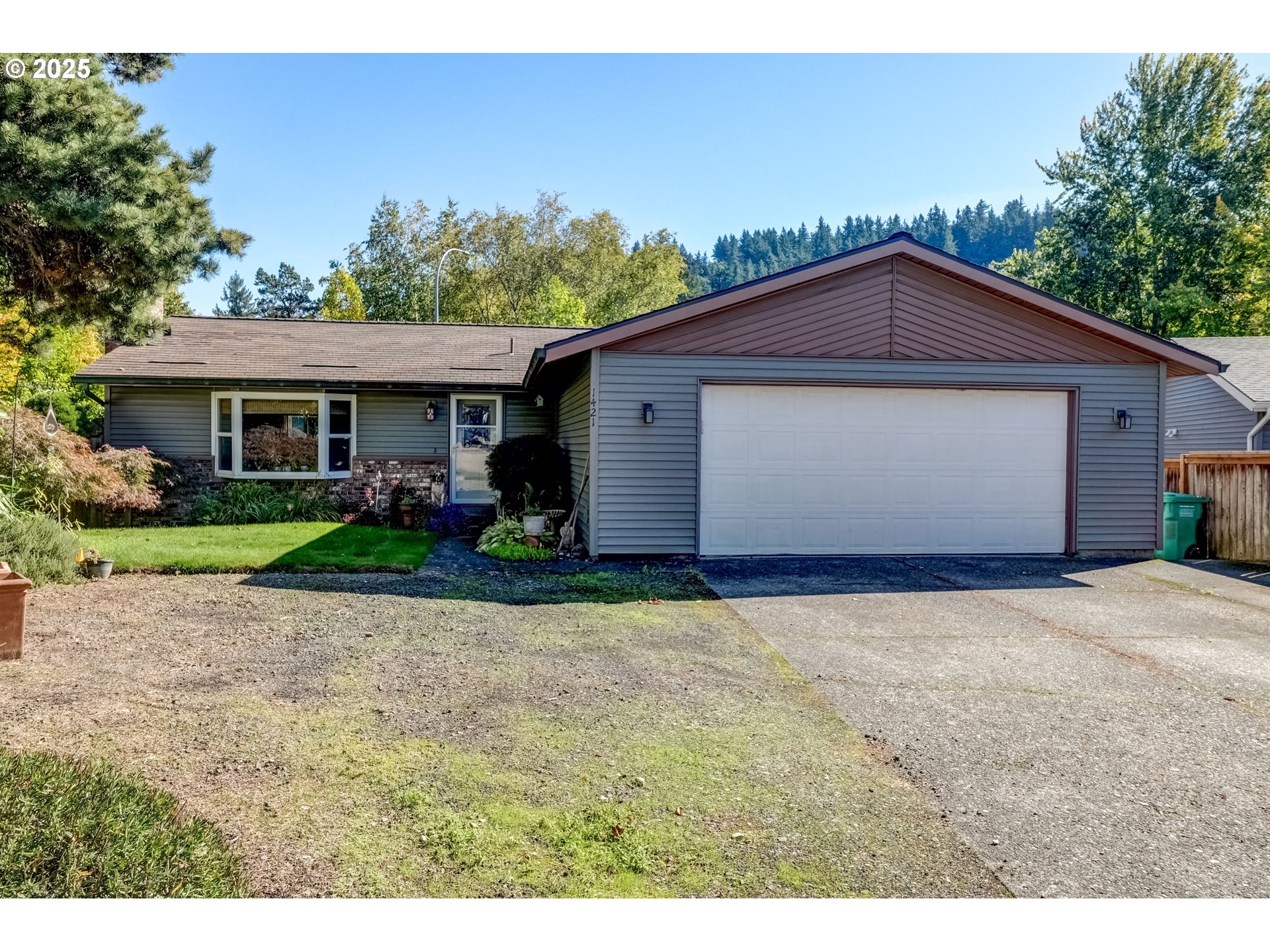 1421 Southwest 6th Place Gresham, OR 97080 - Photo 2 of 27 a front view of house with yard and trees in the background