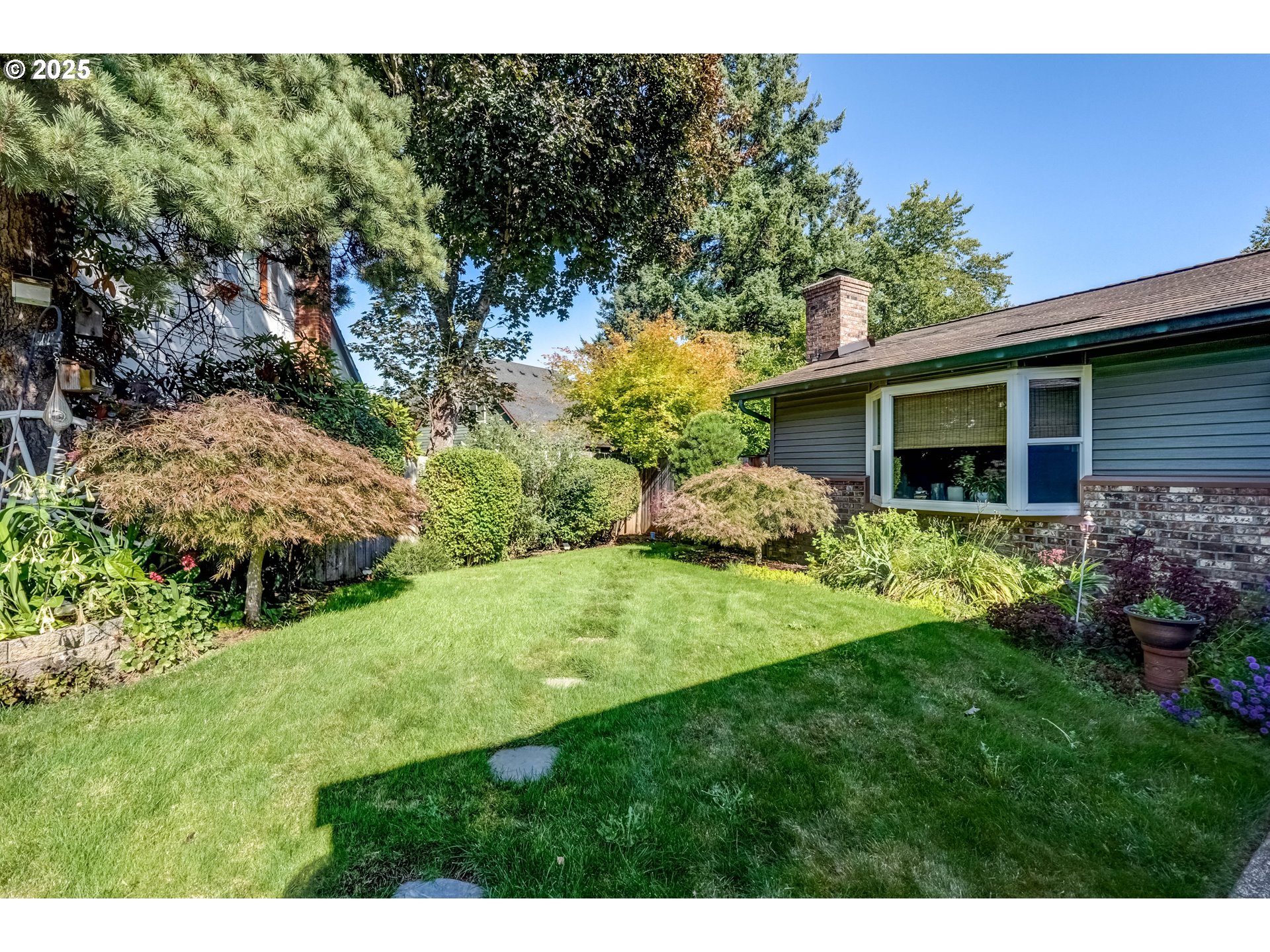 1421 Southwest 6th Place Gresham, OR 97080 - Photo 5 of 27 a view of backyard with garden and plants