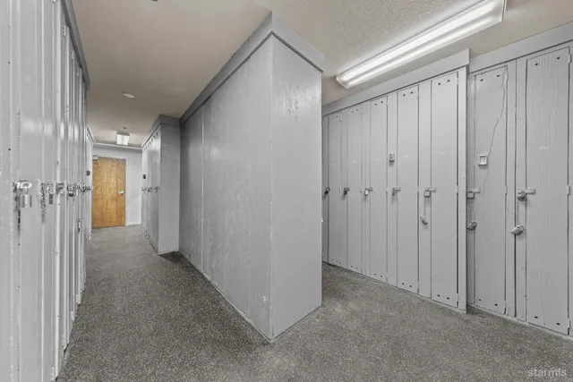 a hallway with a bench in front of building