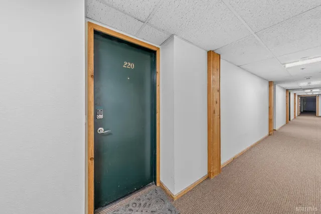 a living room with furniture a dining table and chairs with wooden floor