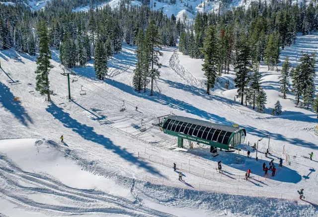 an aerial view of a chairs and table on the terrace