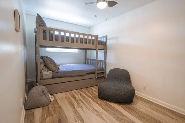 a bedroom with a bed and a chair