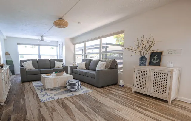 a living room with furniture and a window