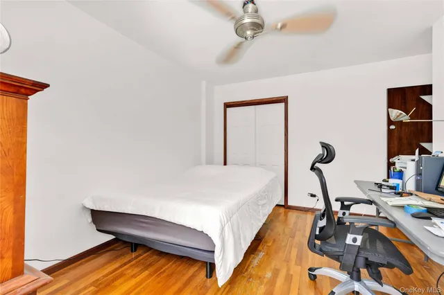 a bed room with a bed and a chandelier