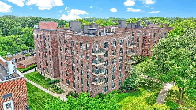 a view of backyard with a garden and outdoor seating