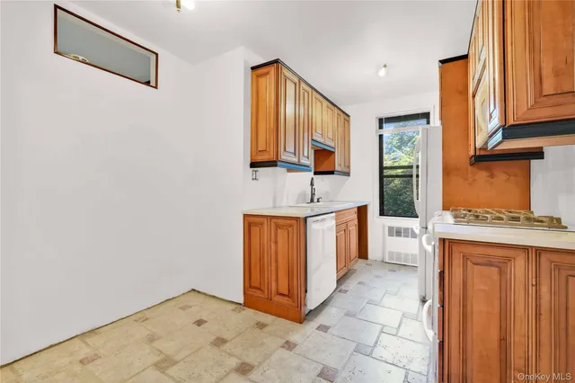 a view of a kitchen with cabinets