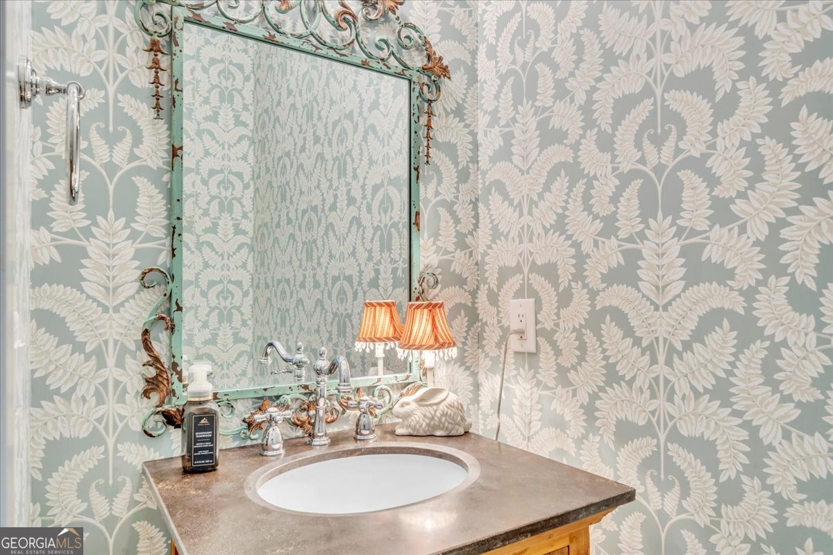 117 Pine Bough Trail Perry, GA 31069 - Photo 21 of 83 a bathroom with a sink and a mirror