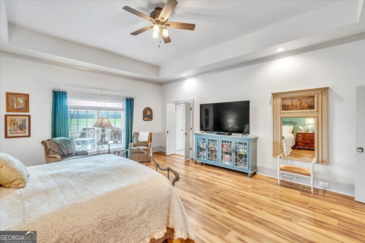 117 Pine Bough Trail Perry, GA 31069 - Photo 23 of 83 a bedroom with furniture and a flat screen tv