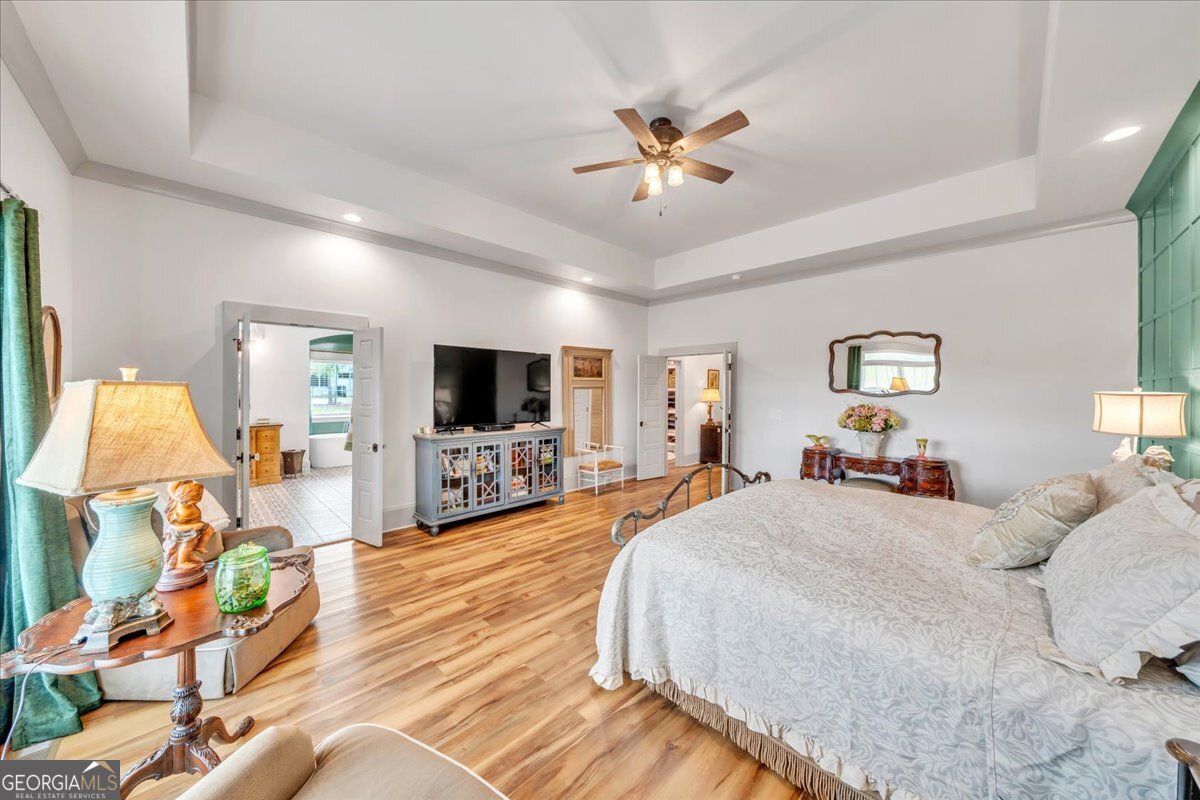 117 Pine Bough Trail Perry, GA 31069 - Photo 24 of 83 a bedroom with a bed and a flat screen tv