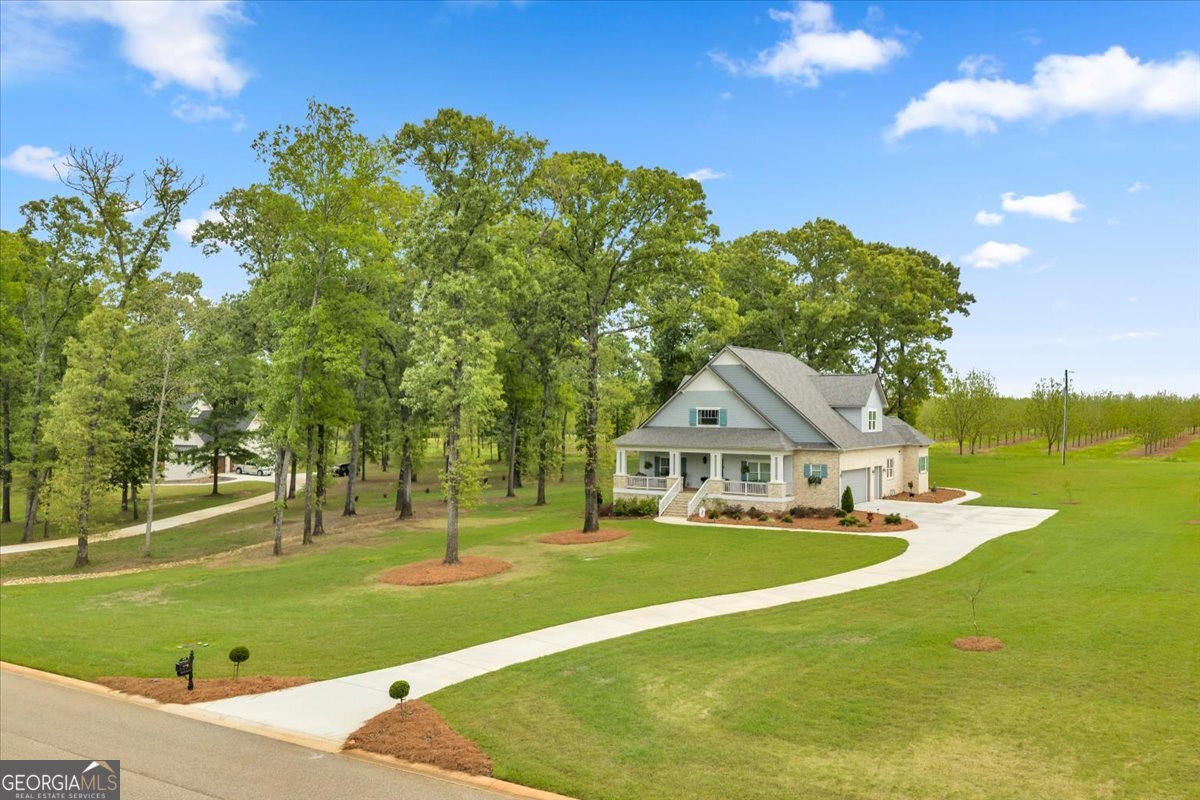 117 Pine Bough Trail Perry, GA 31069 - Photo 3 of 83 a front view of a house with a big yard