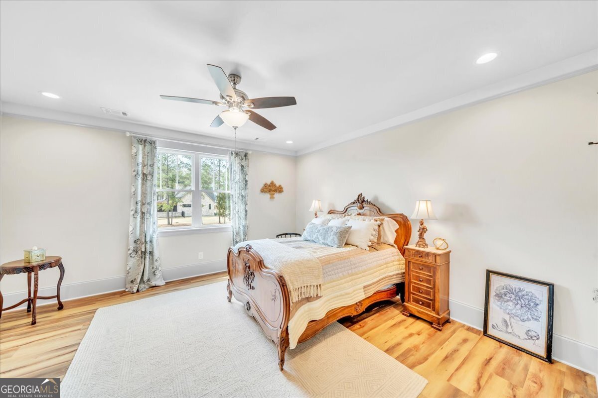 117 Pine Bough Trail Perry, GA 31069 - Photo 39 of 83 a bedroom with a bed and a table in it