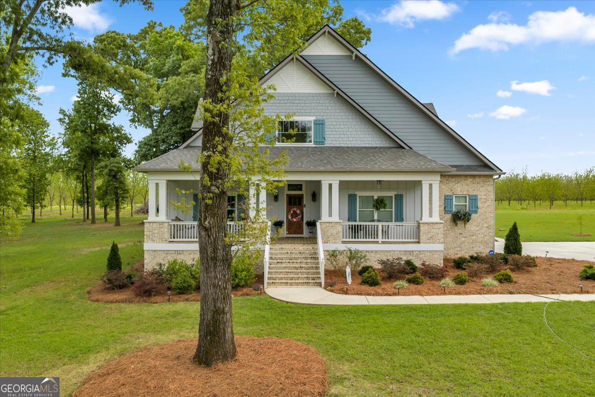 117 Pine Bough Trail Perry, GA 31069 - Photo 59 of 83 a front view of house with a garden and patio
