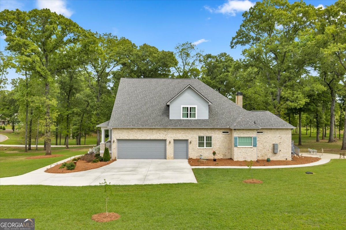 117 Pine Bough Trail Perry, GA 31069 - Photo 66 of 83 a front view of a house with a yard