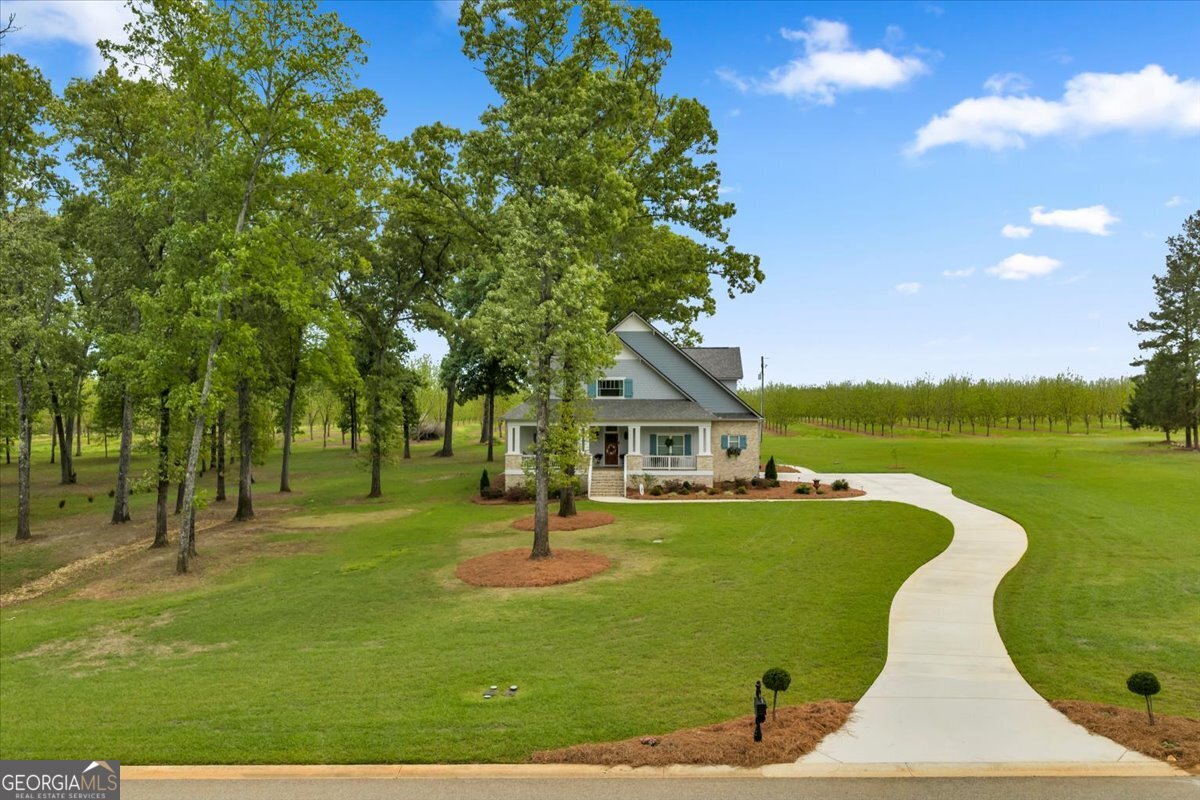 117 Pine Bough Trail Perry, GA 31069 - Photo 70 of 83 a view of a house with a backyard