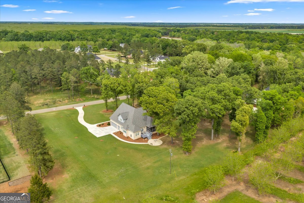 117 Pine Bough Trail Perry, GA 31069 - Photo 74 of 83 a view of a lake from a yard